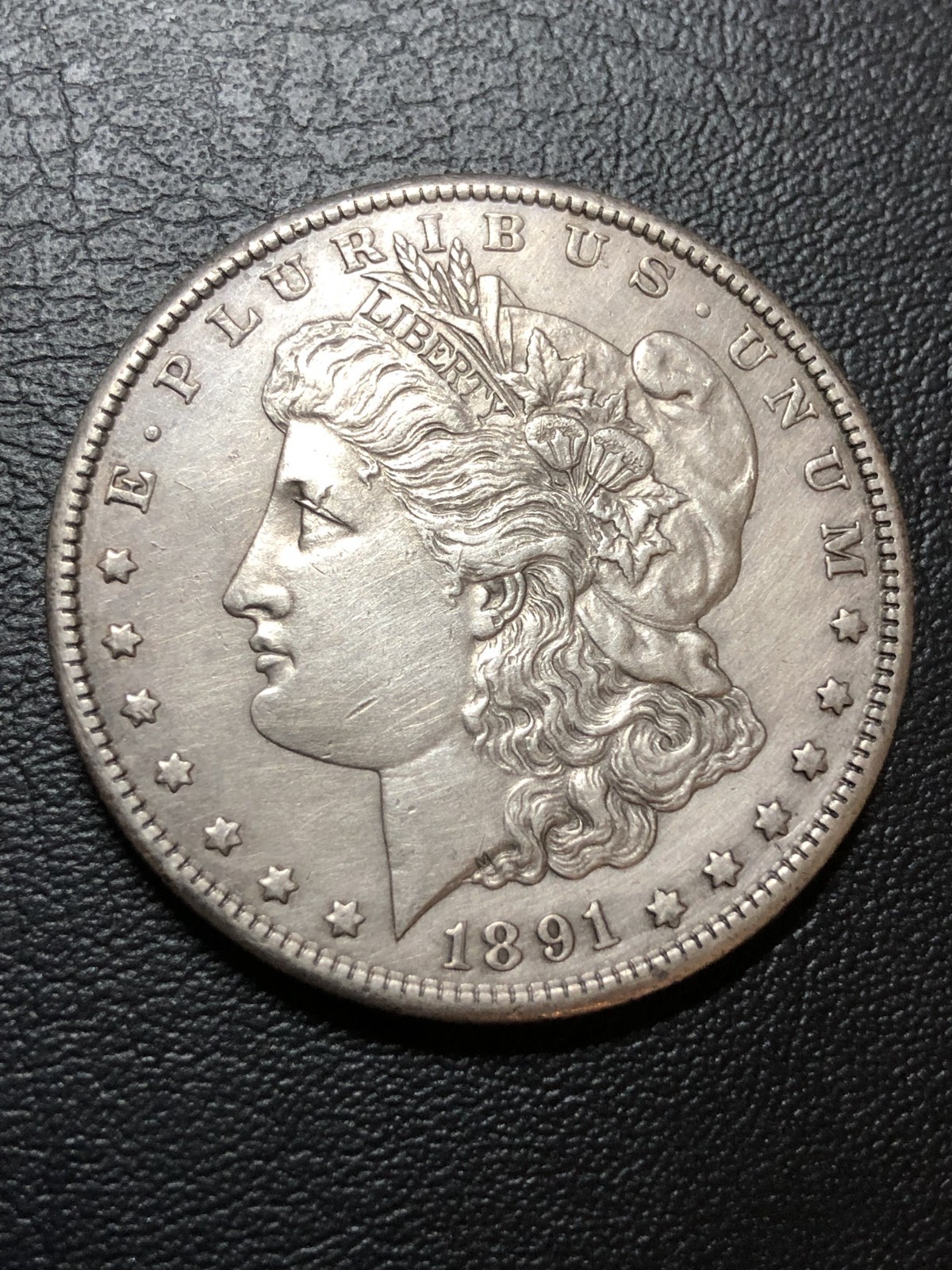 1891-S Morgan Silver Dollar - HARSHLY CLEANED but nice eye appeal