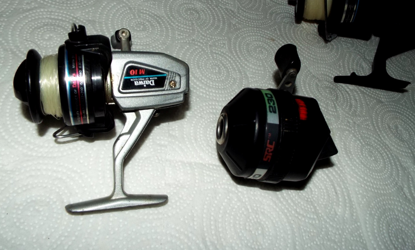 7 VINTAGE FISHING REELS WITH SOME EXTRA SPOOLS GARCIA, QUANTAM ETC.... READ!!!
