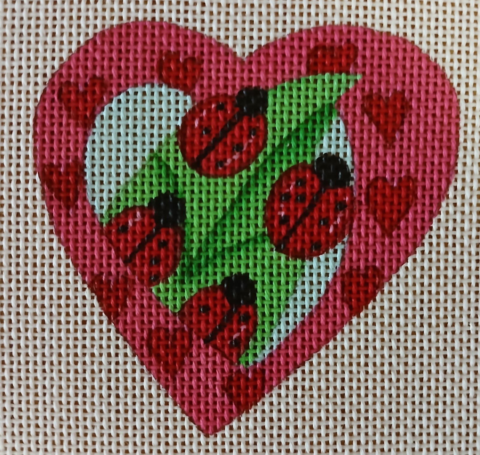Hand-painted Ladybug Heart 18-count needlepoint canvas. 437-D, 2000. M50