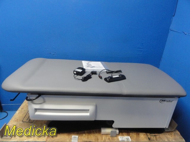 UMF 3002 FusionONE Exam Table; Graphite W/ Foot Pedal, PSU, Stirrups & Pan~37509