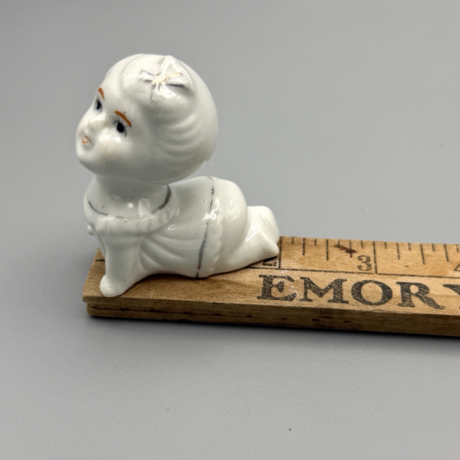 Vintage little Baby Crawling Figurine Gold gilt trim lining Cute 1950’s 2”