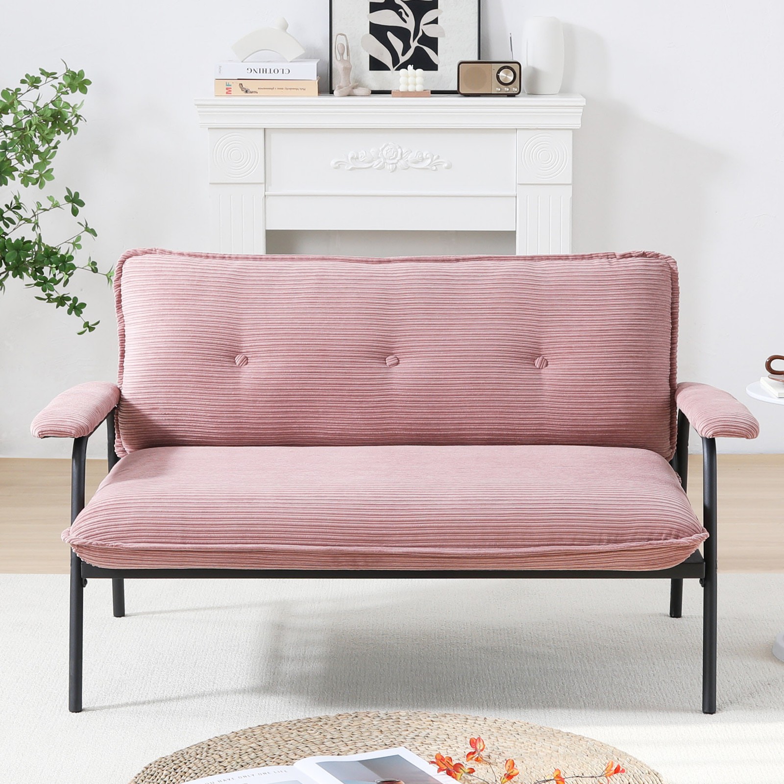 The 53-inch pink sofa offers a spacious layout in the small apartment, easily