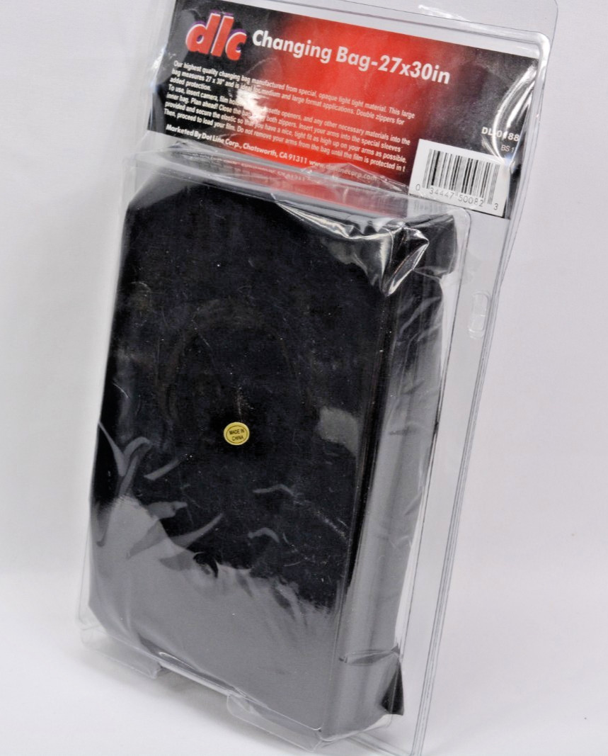Film changing bag, for handling film in the field, or at home without a darkroom