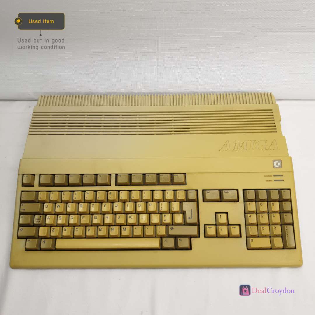 COMMODORE AMIGA A500 COMPUTER +COMMODORE A520 +MOUSE + 10 DISKS + POWER SUPPLY