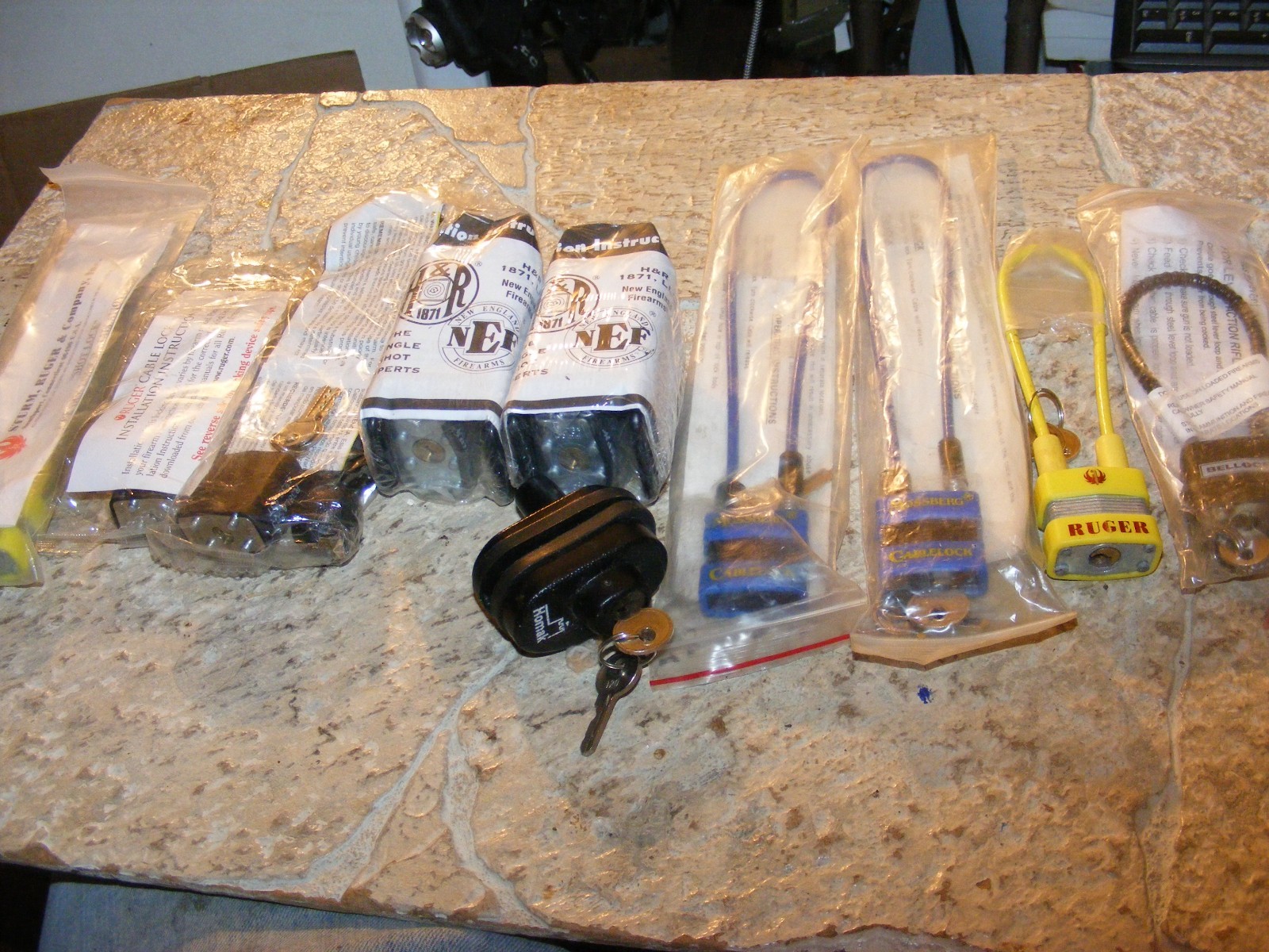 10 Gun Safety Locks, 3 Ruger Cable, Bellock, 2 Mossberg, Homak, 2 NEF Padlocks