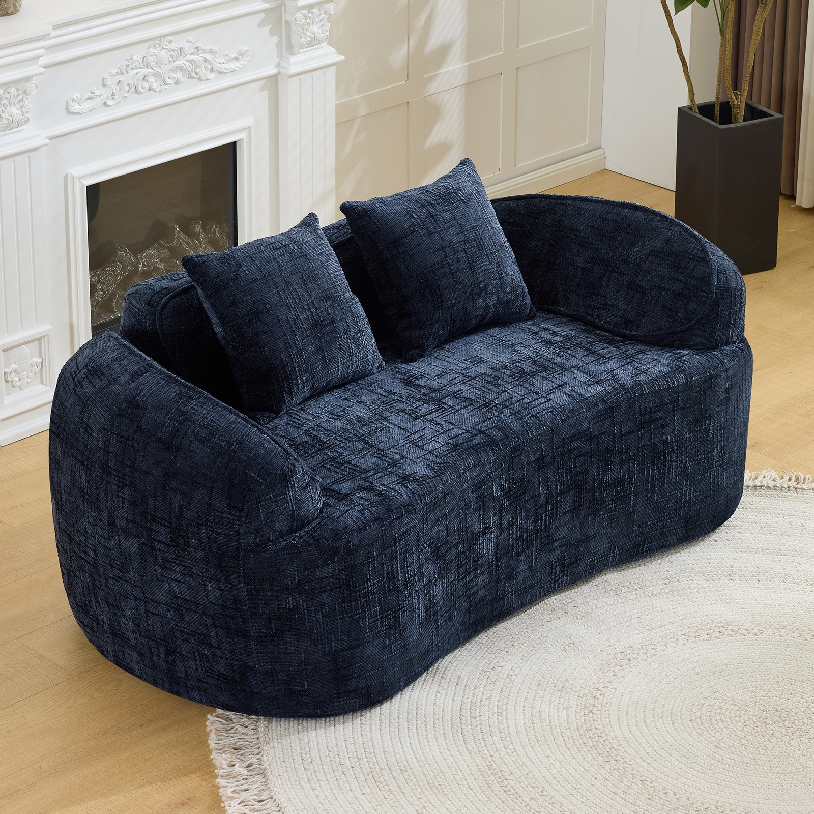 Dark Blue curved two - person compress  sofa. It has armrests on both sides, com