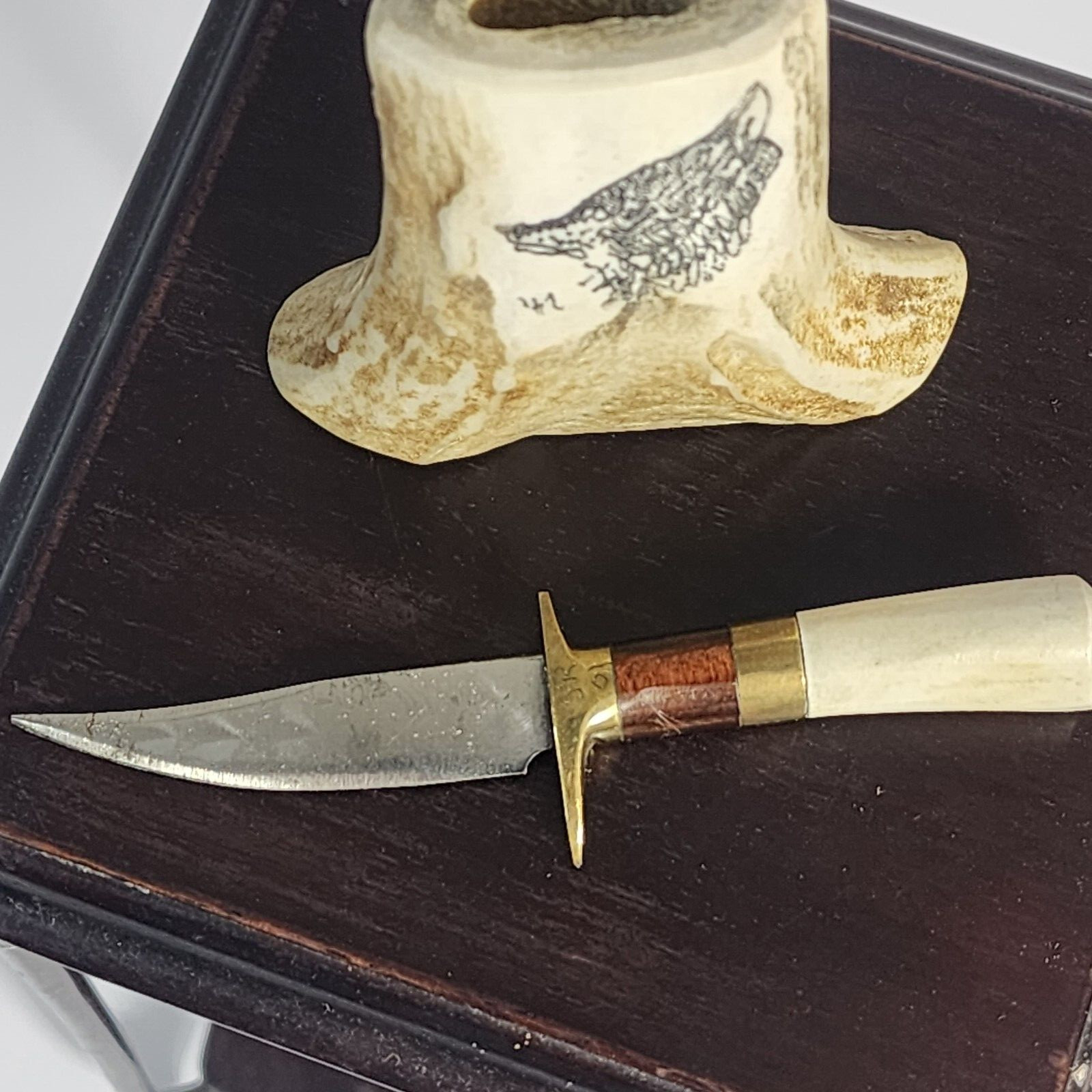 Small Knife In Bone looking Holder With Wolf On