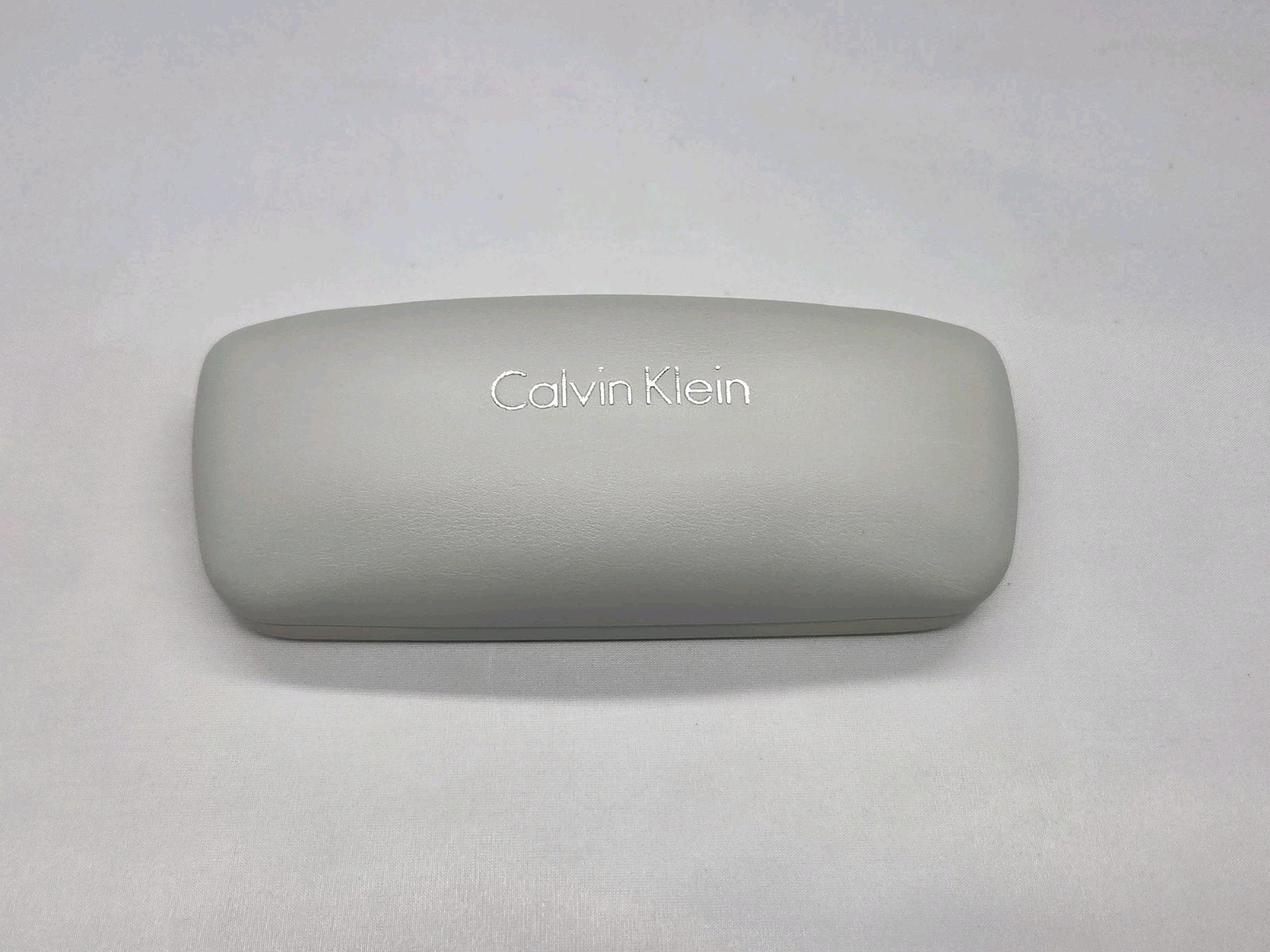 Calvin Klein Light Gray Clamshell Eyeglass Case