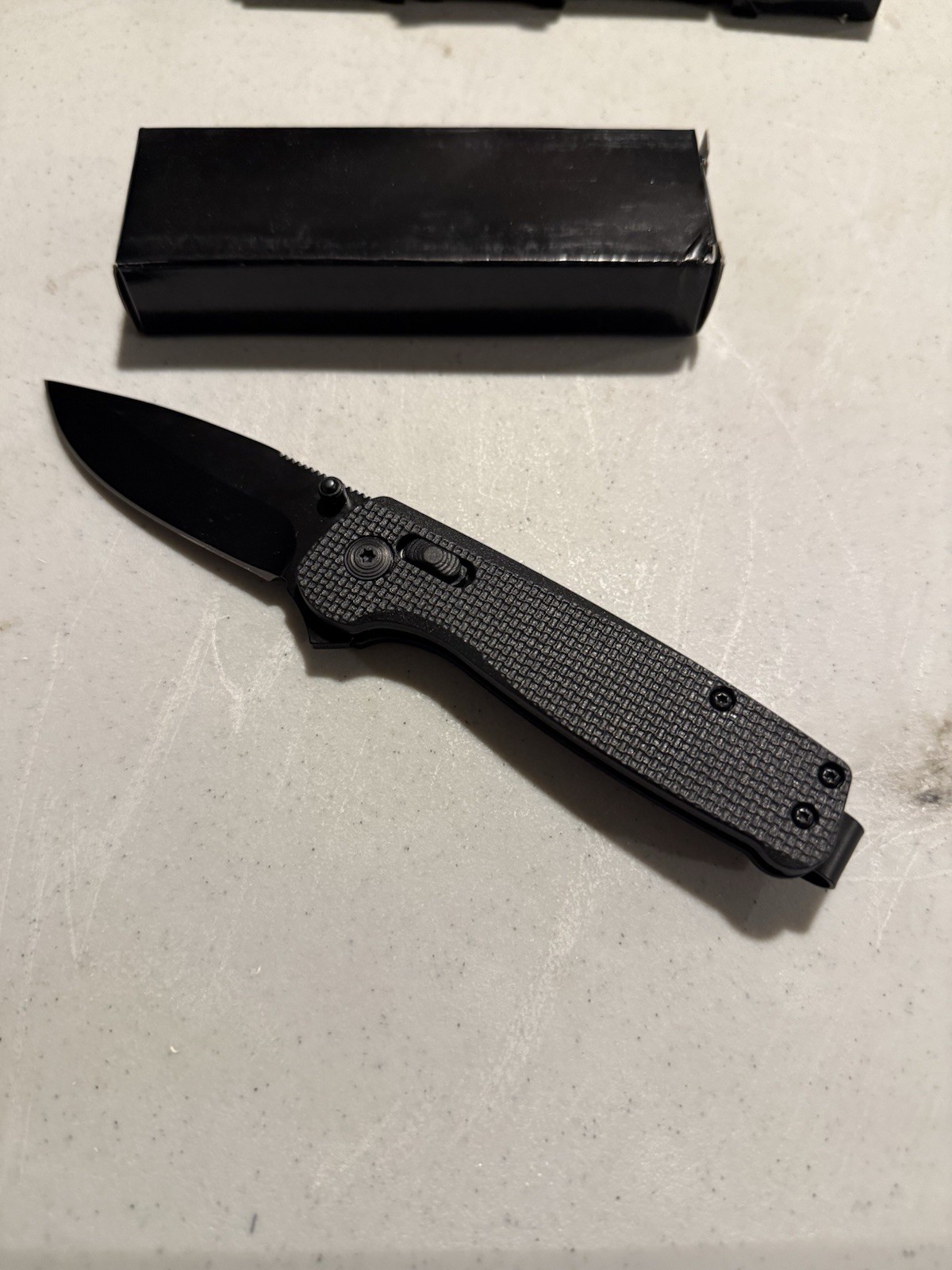 Black Folding Pocketknife Drop Point Blade Textured Handle Manual Opening