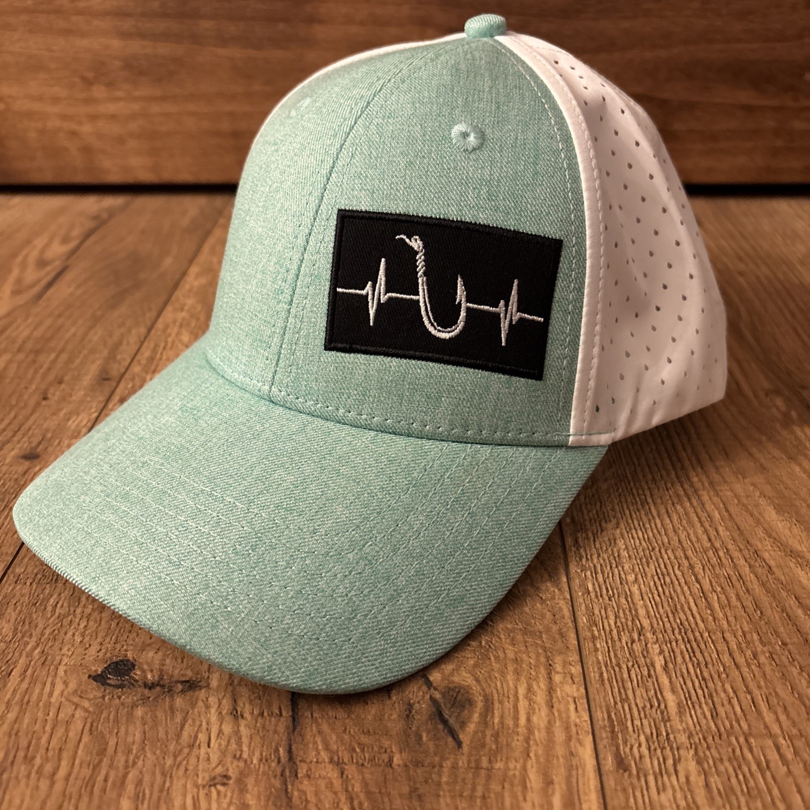 The Heartbeat Brand fishing hat in a Turquoise ocean blue - Streets