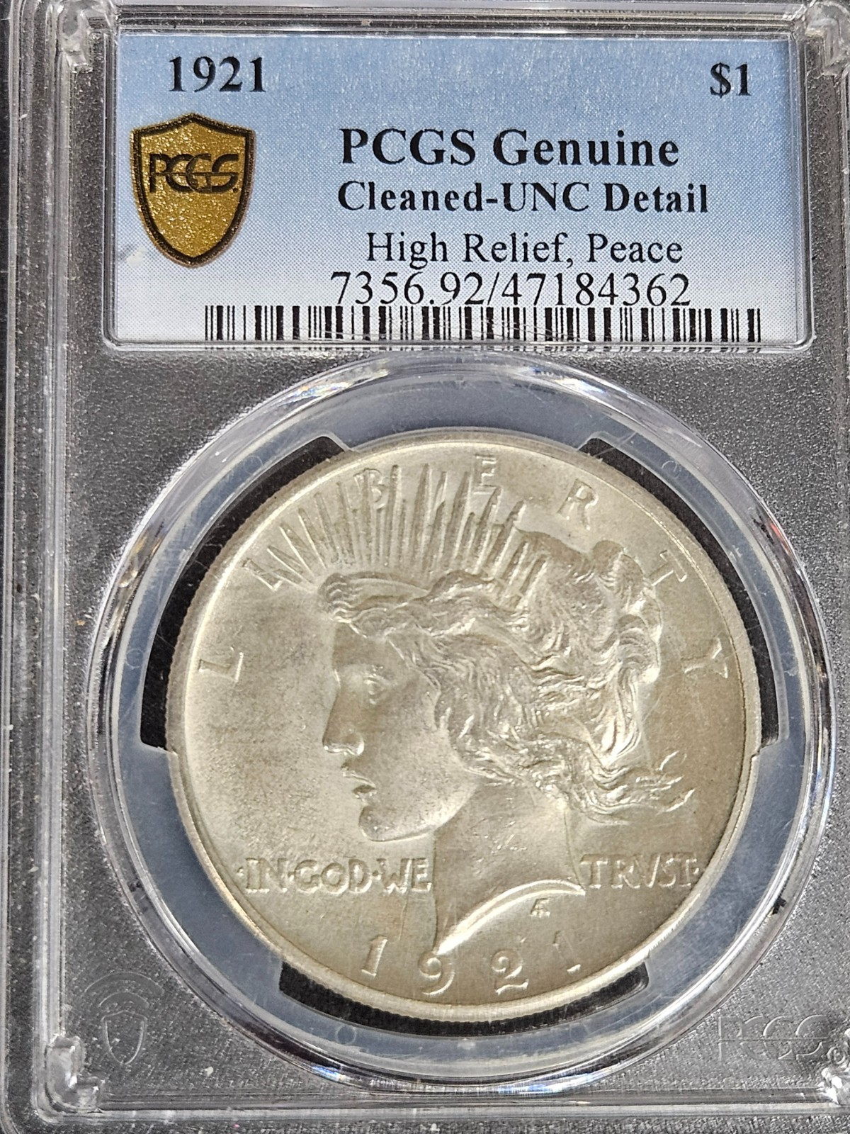 1921 Peace UNC/Cleaned. MS-64 But it is cleaned. (I don't see it.)