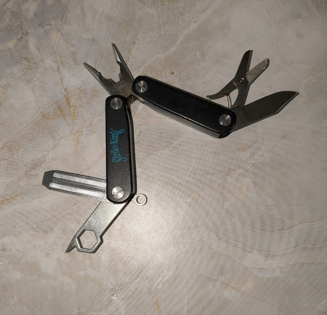 Black STRIKE KING Multi-Tool with Pliers File Scissors & More