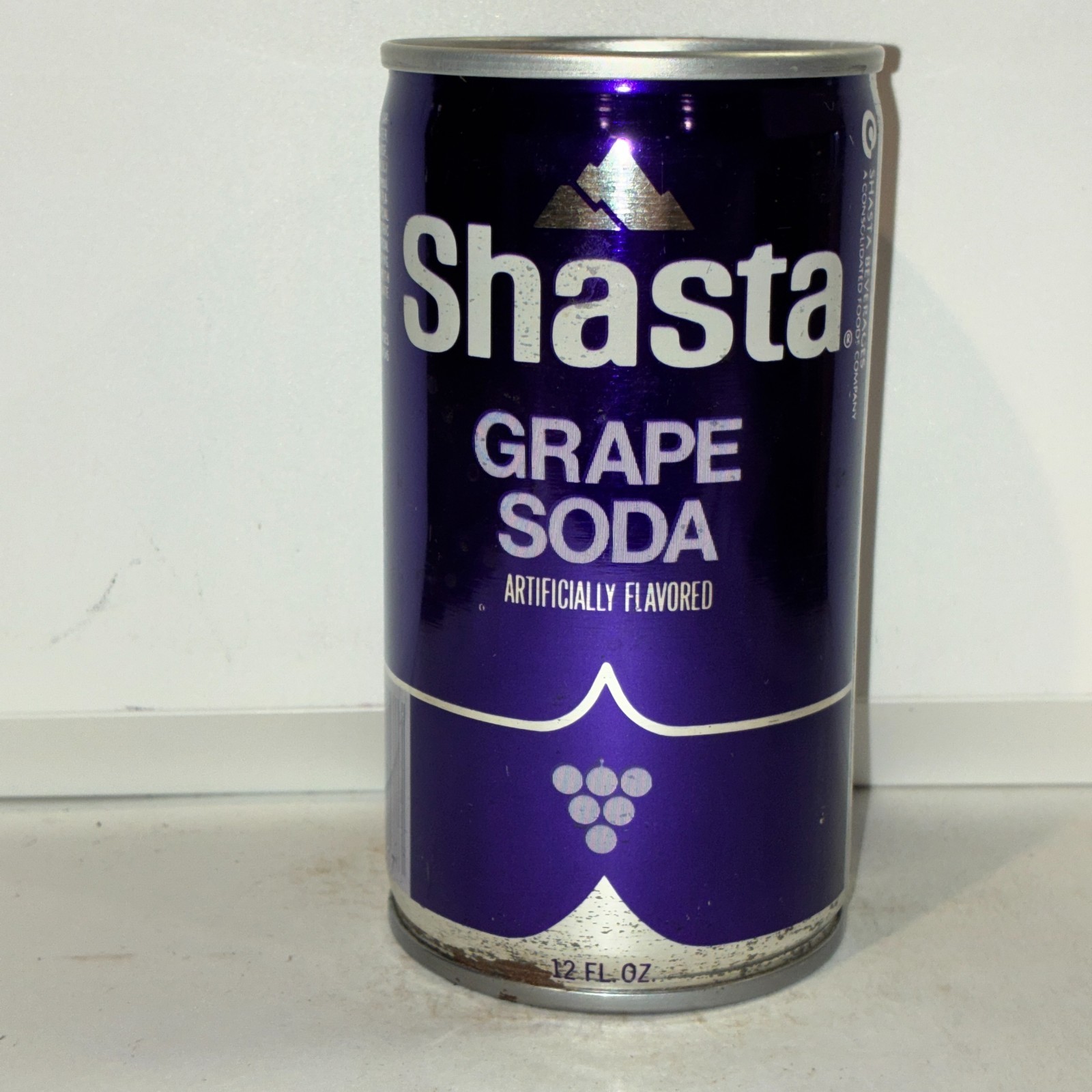 Shasta Grape Soda can, crimped steel, bottom opened