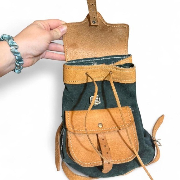 Forest Green Suede and Tan Leather backpack with adjustable straps.