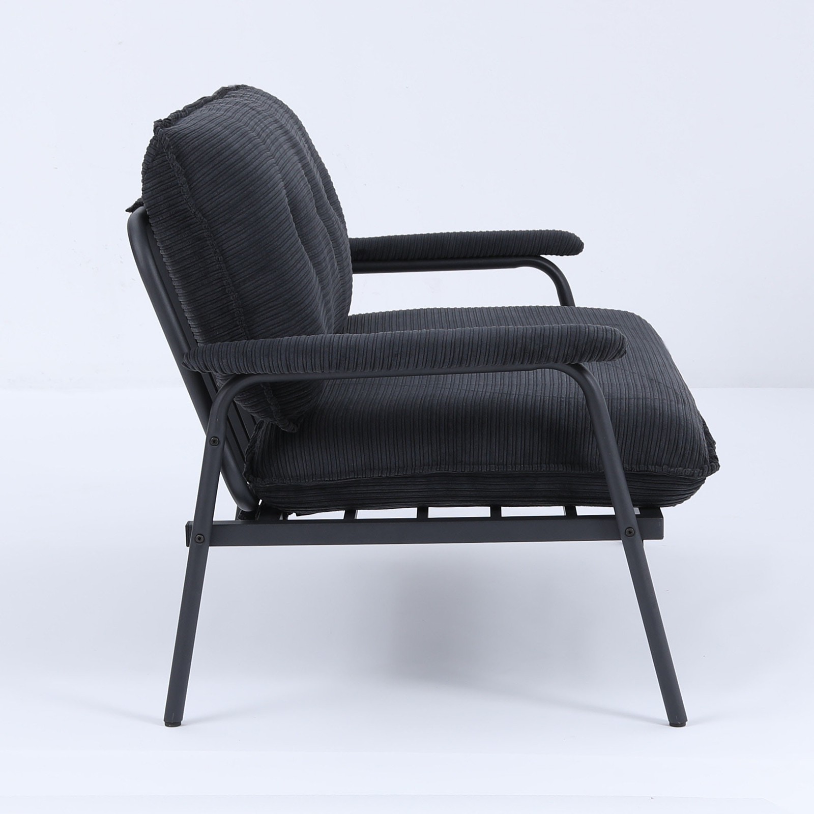 The 53-inch black sofa offers a spacious layout in the small apartment, easily