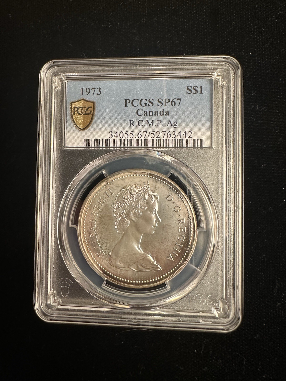 MONSTER RAINBOW TONED - 1973 Canada Silver Dollar RCMP Centennial┃PCGS SP67