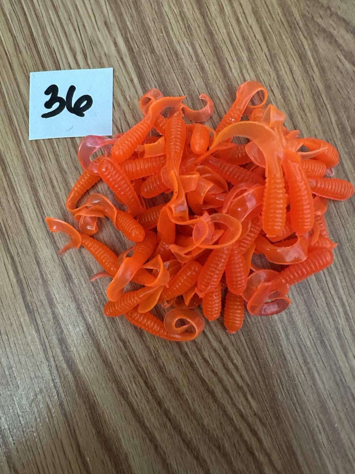 Item#36  50ct 2" Florescent orange curly tail grub, bait, soft plastics, fishing