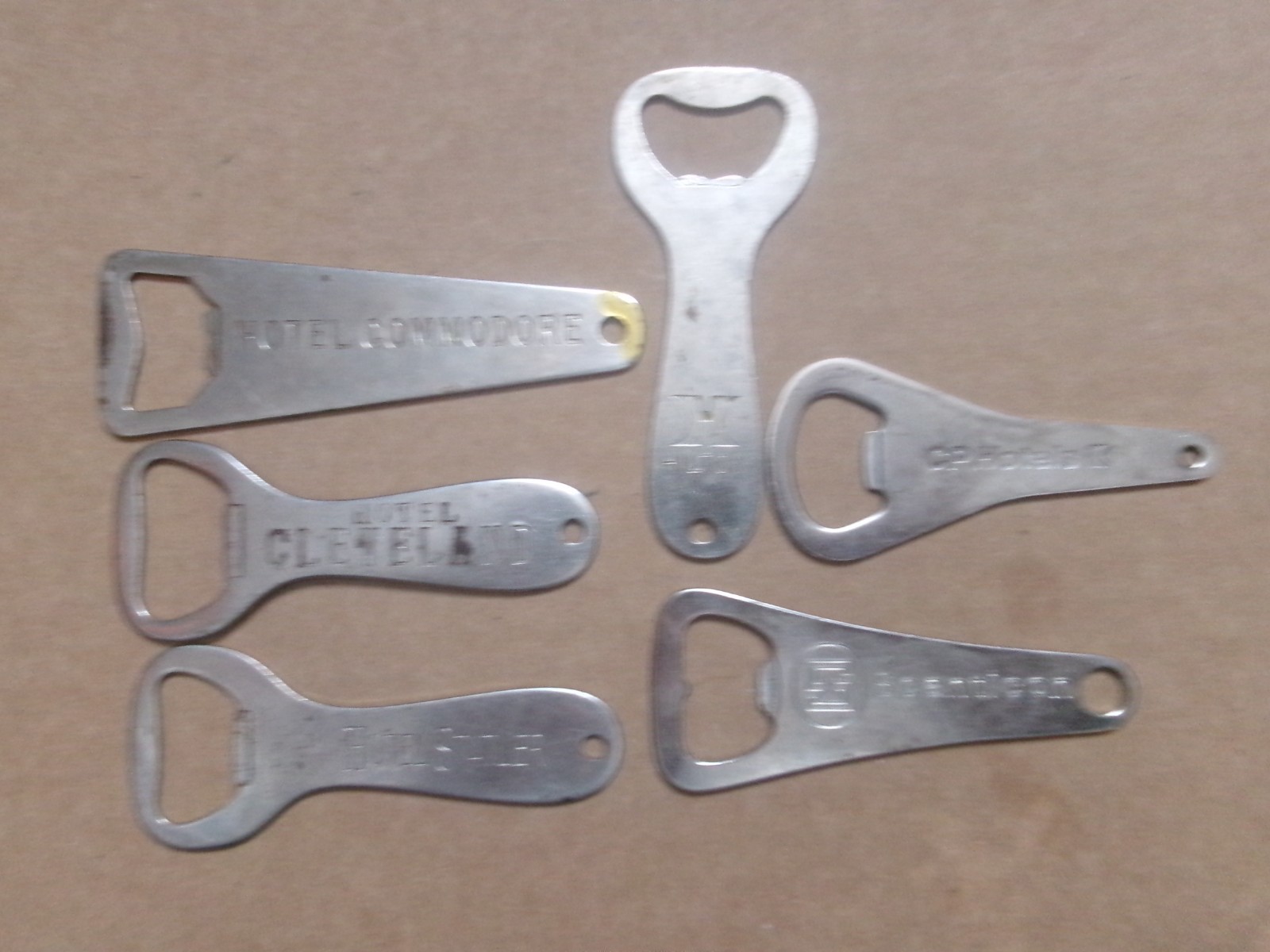 Six Different Hotel Metal Bottle Openers