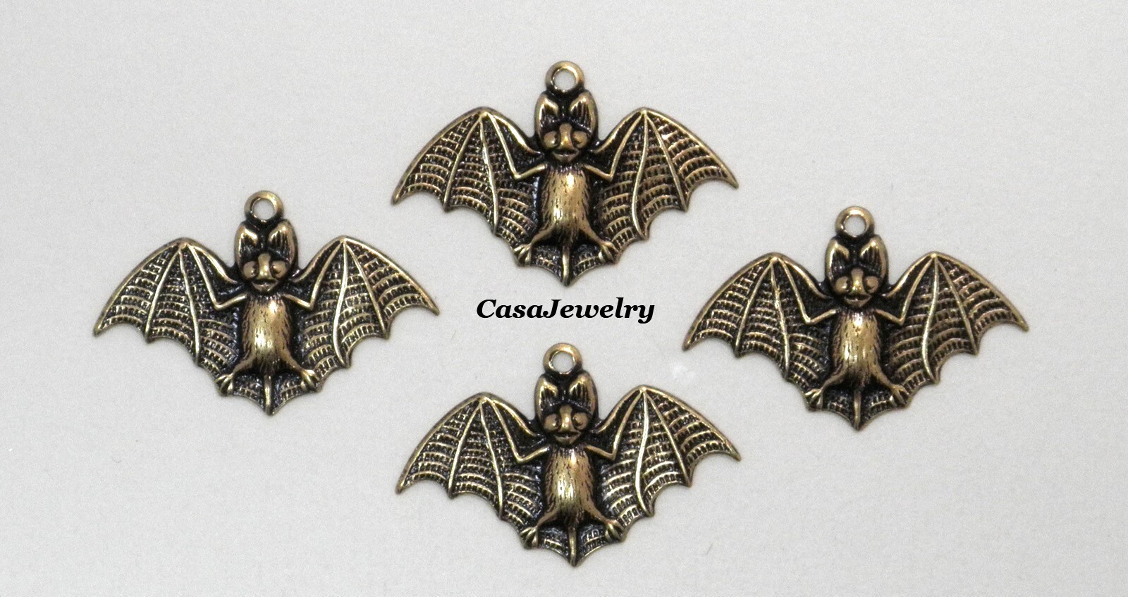 #0411 SMALL ANTIQUED GOLD BAT W/TOP HANG RING - 4 Pcs