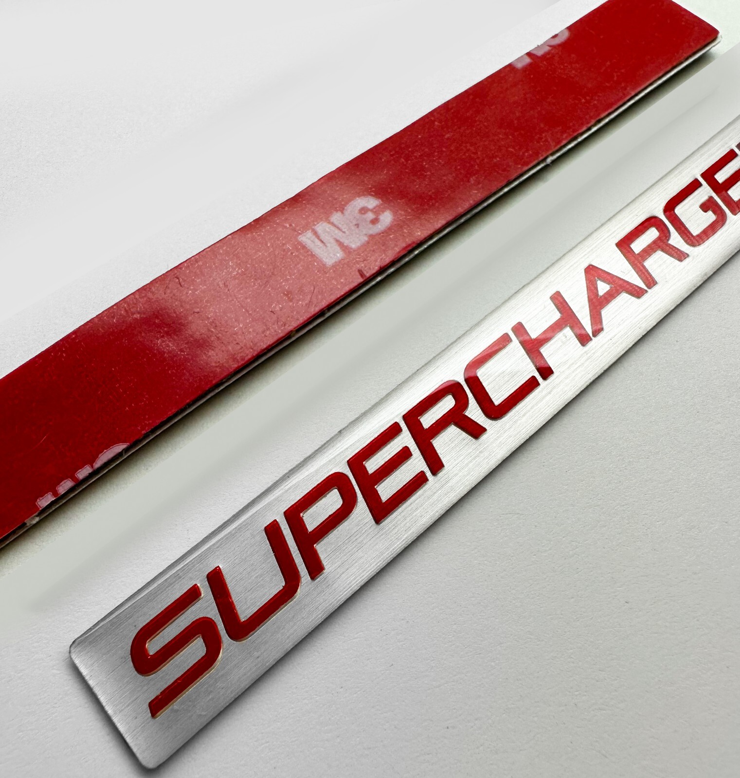 1 -BRAND NEW Embossed Aluminum SUPERCHARGED Badge Emblem SUPERCHARGED Silver Red