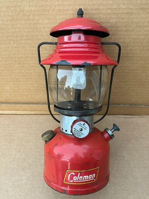 Vintage Coleman 1950s single mantle red gas camping lantern, outdoor collectible