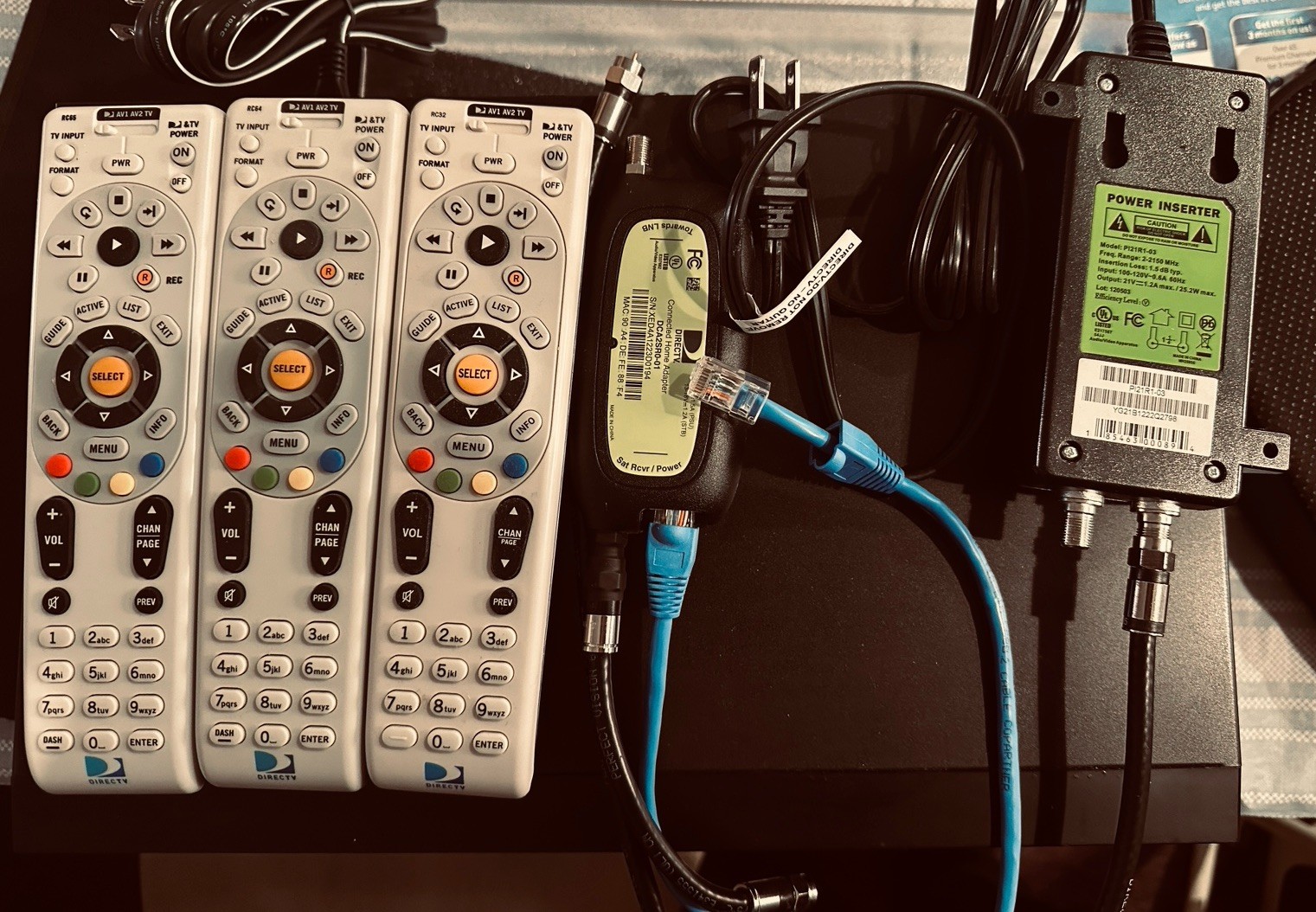 Two tv receivers Three Remote One Connected Adapter One Power Inserted