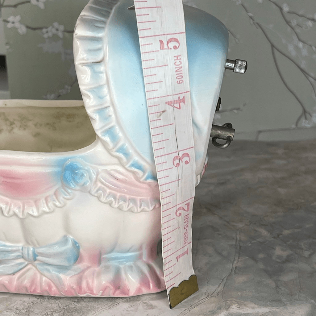 Inarco E- 3502 musical baby bassinet planter.