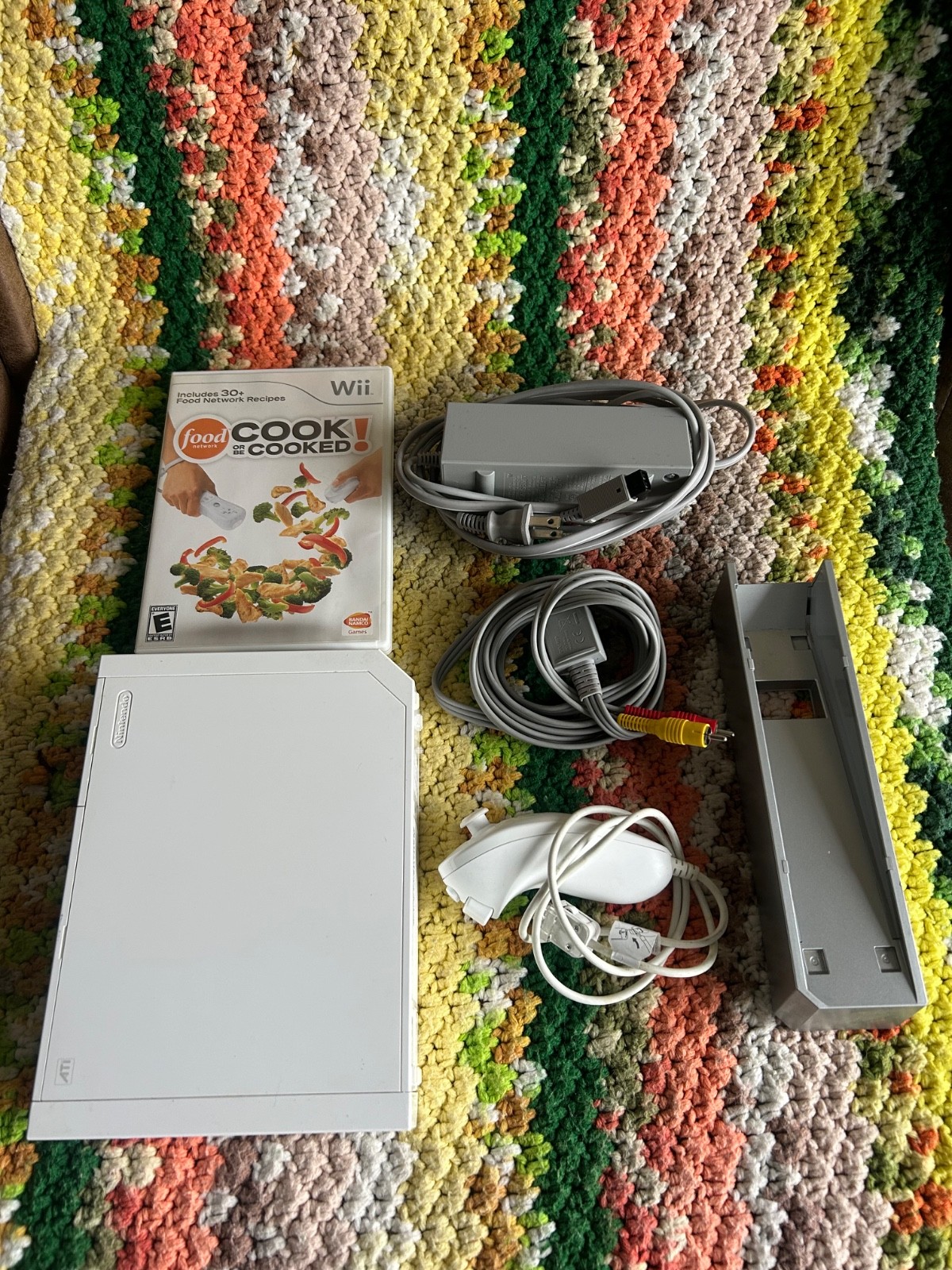 Nintendo Wii console, game, and power cords, tested and working