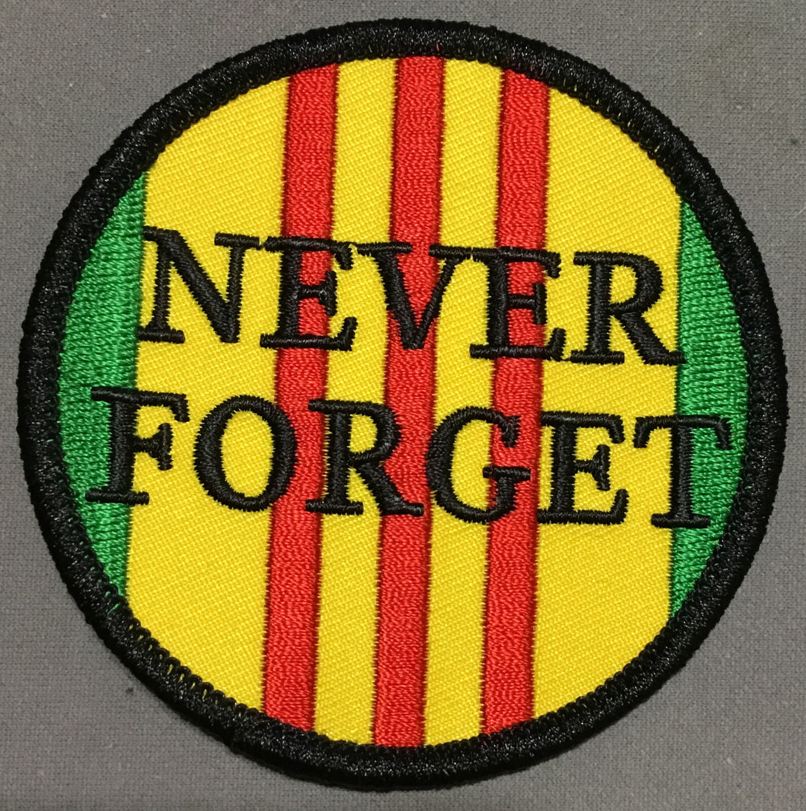Never Forget overlaid on Vietnam patch
