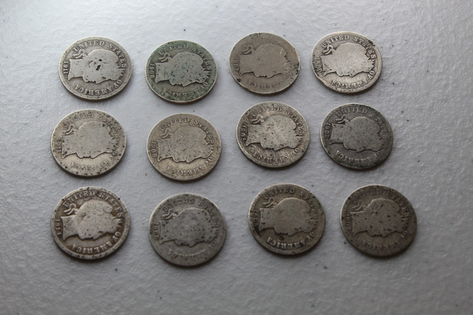 12 Very Old Very Worn Barber Dimes with dates