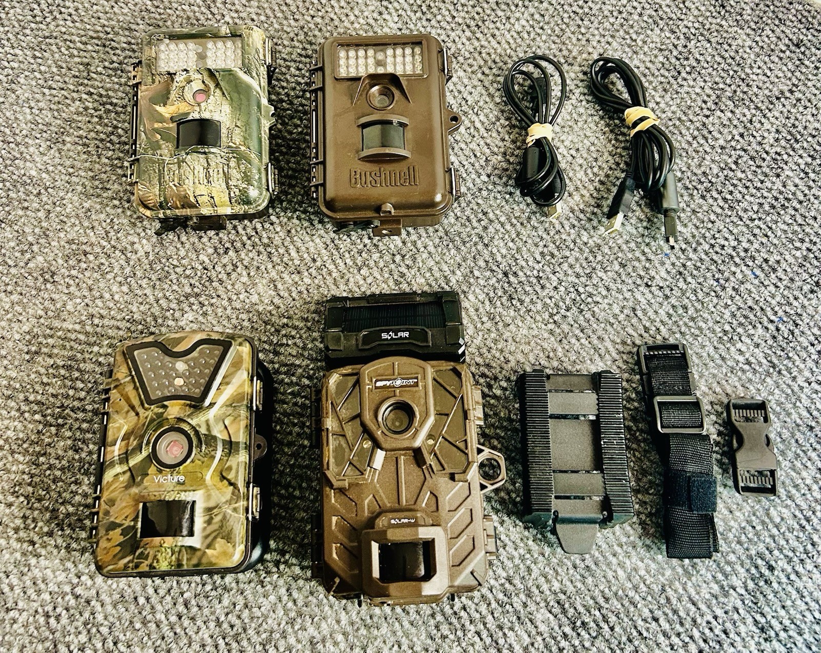 (4) Hunting Trail Cameras…. (2) Bushnell, (1) Victure, (1) Spy Point Solar