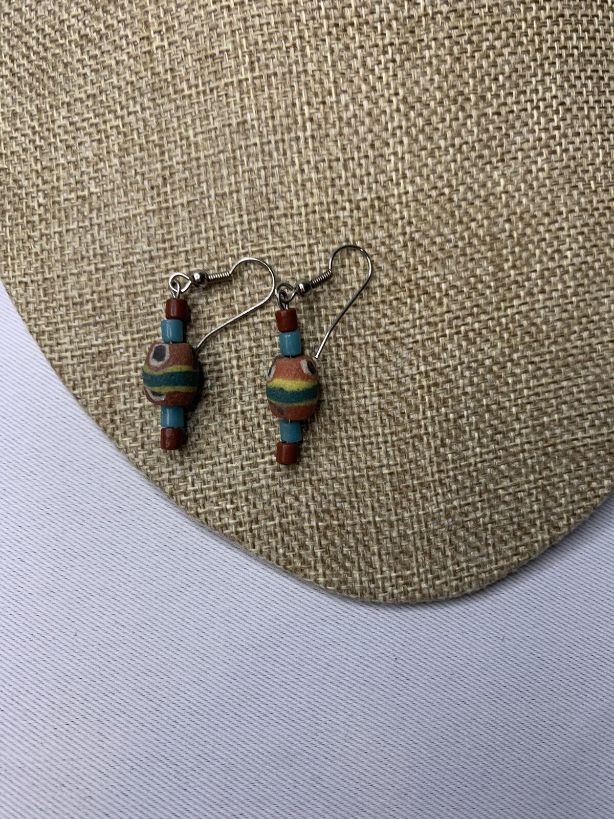Silvertone and painted wood pierced earrings