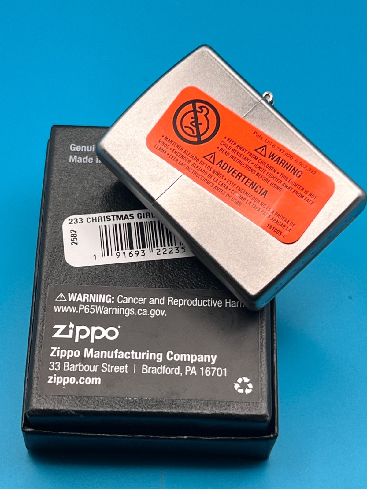 Genuine Brand New 2017 ZIPPO Lighter PULLING A CRACKER BY THE FIRE Satin Chrome