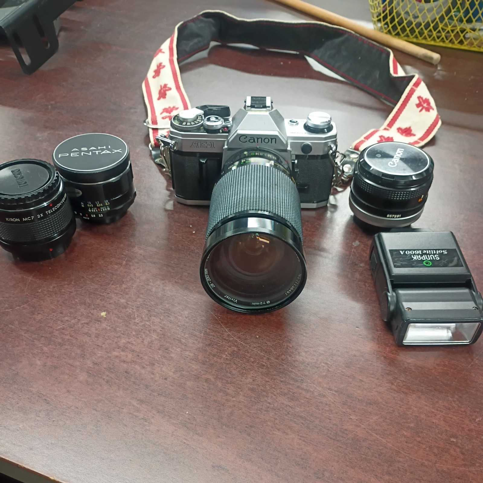 Canon AE-1 Camera, 28-200mm Lens, 50 mm lense, with 2 other lenses,Flash, Bag