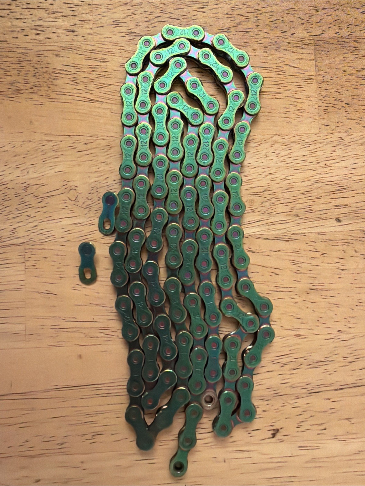 KMC X12 Aurora Green Waxed 116L chain