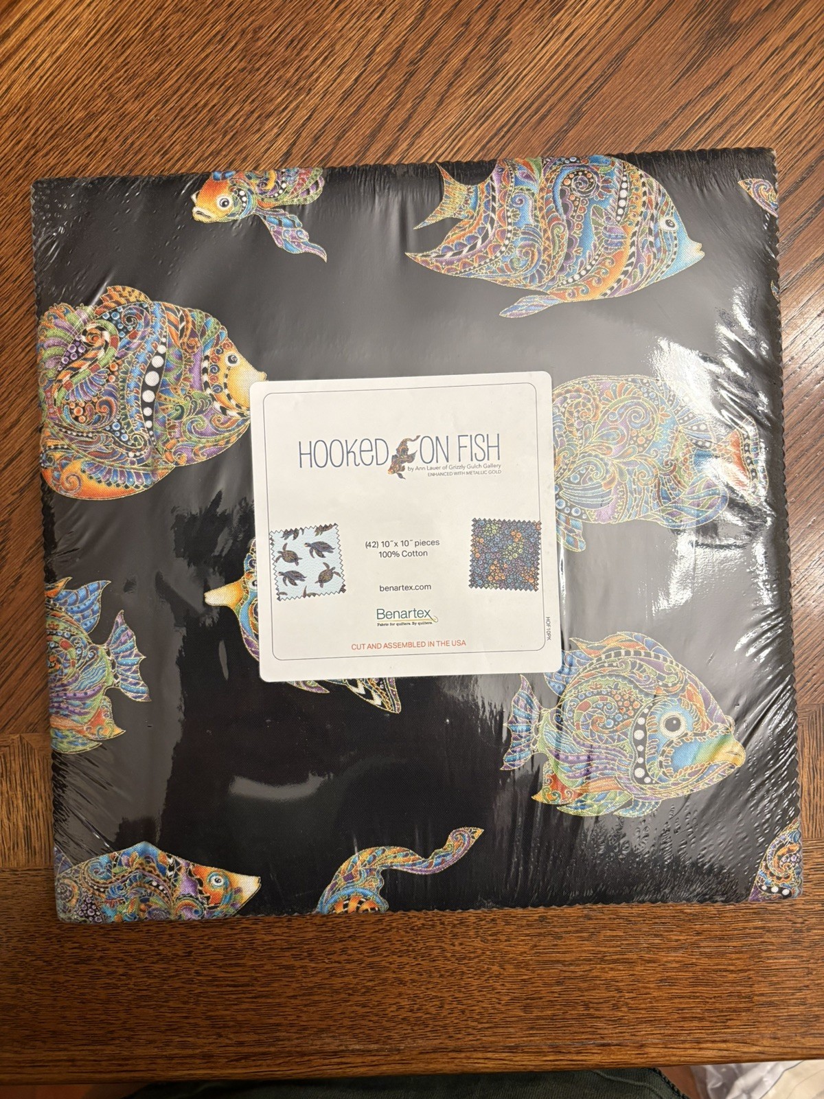Hooked on fish layer cake quilting fabric. New