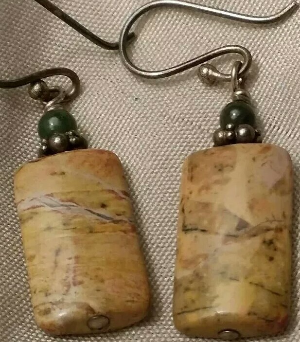 Vintage pierced earrings with brownish green stones