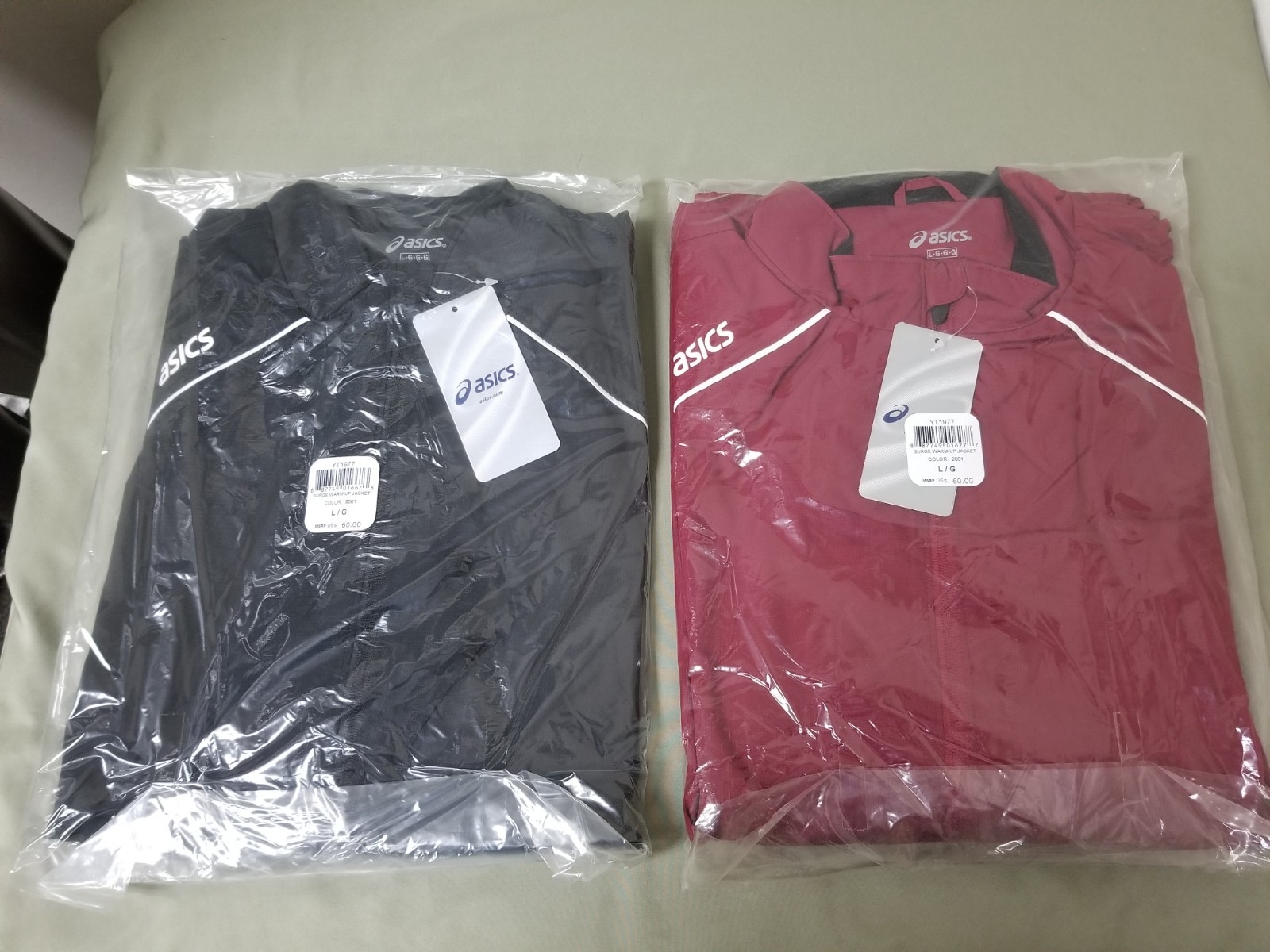 new Asics mens surge warm up jacket.  retail 60.00    two colors to choose.