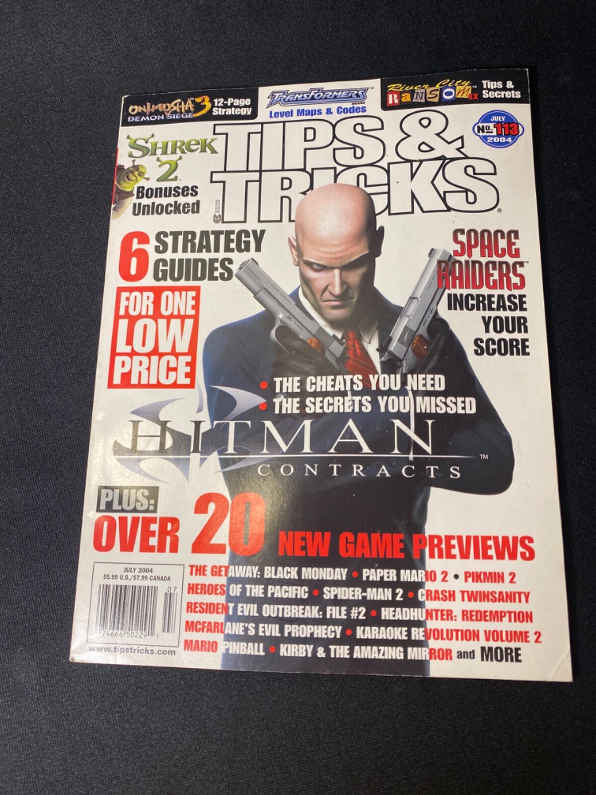 Tips & Tricks #113 July 2004 6 Strategy Guides Hitman Contracts Space Raiders