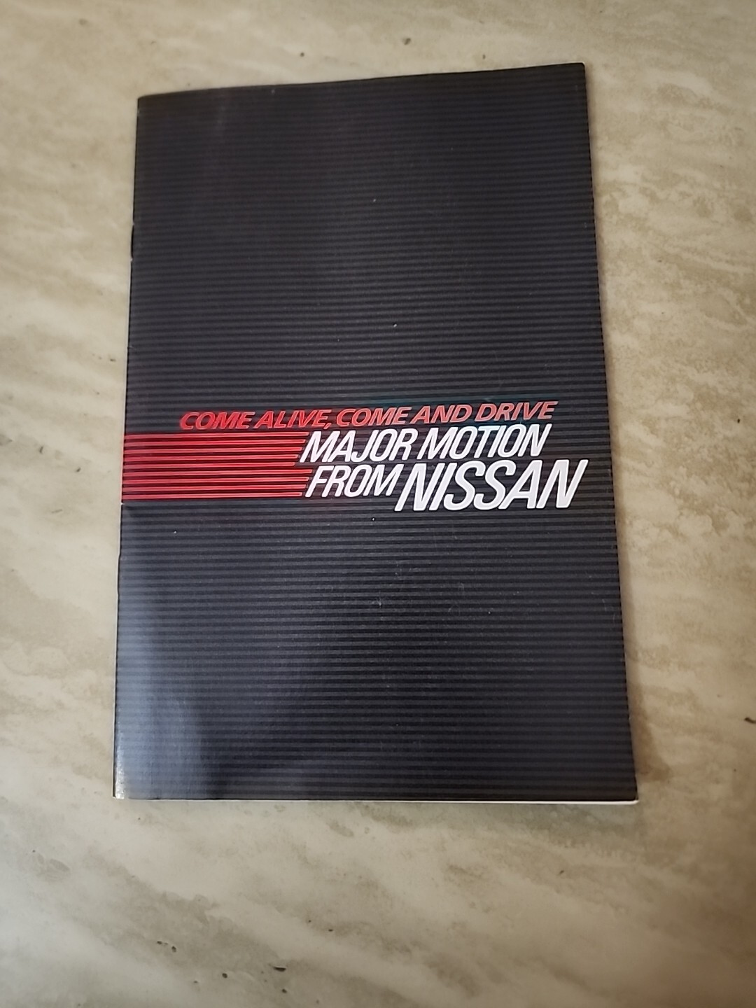 1984 Nissan car range advertising booklet --