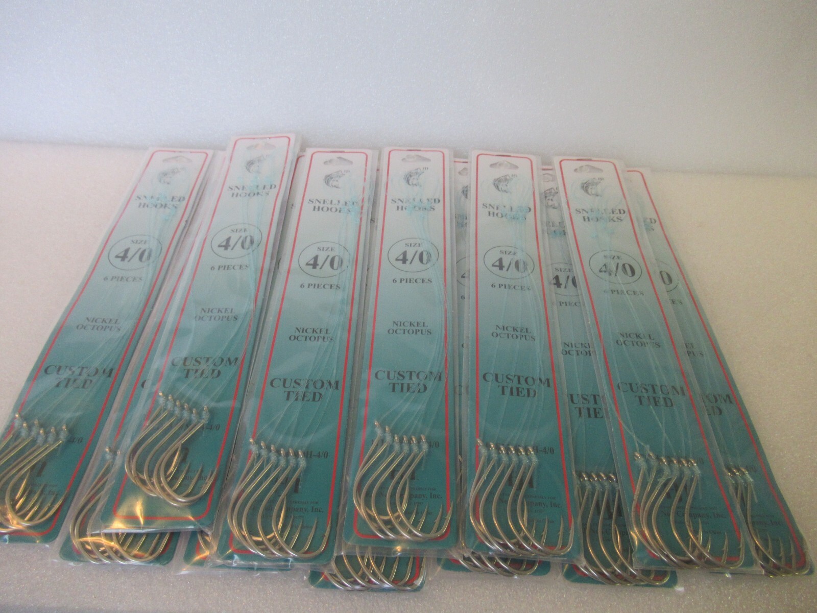 72 SNELLED FISH HOOKS (12 PKS X 6 EA) NICKEL OCTOPUS MONO LEADER 7" PICK SZ