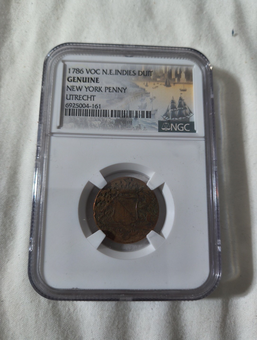 1786 New York Penny VOC NGC Genuine N.E. Indies DUIT UTRECHT (TONER)