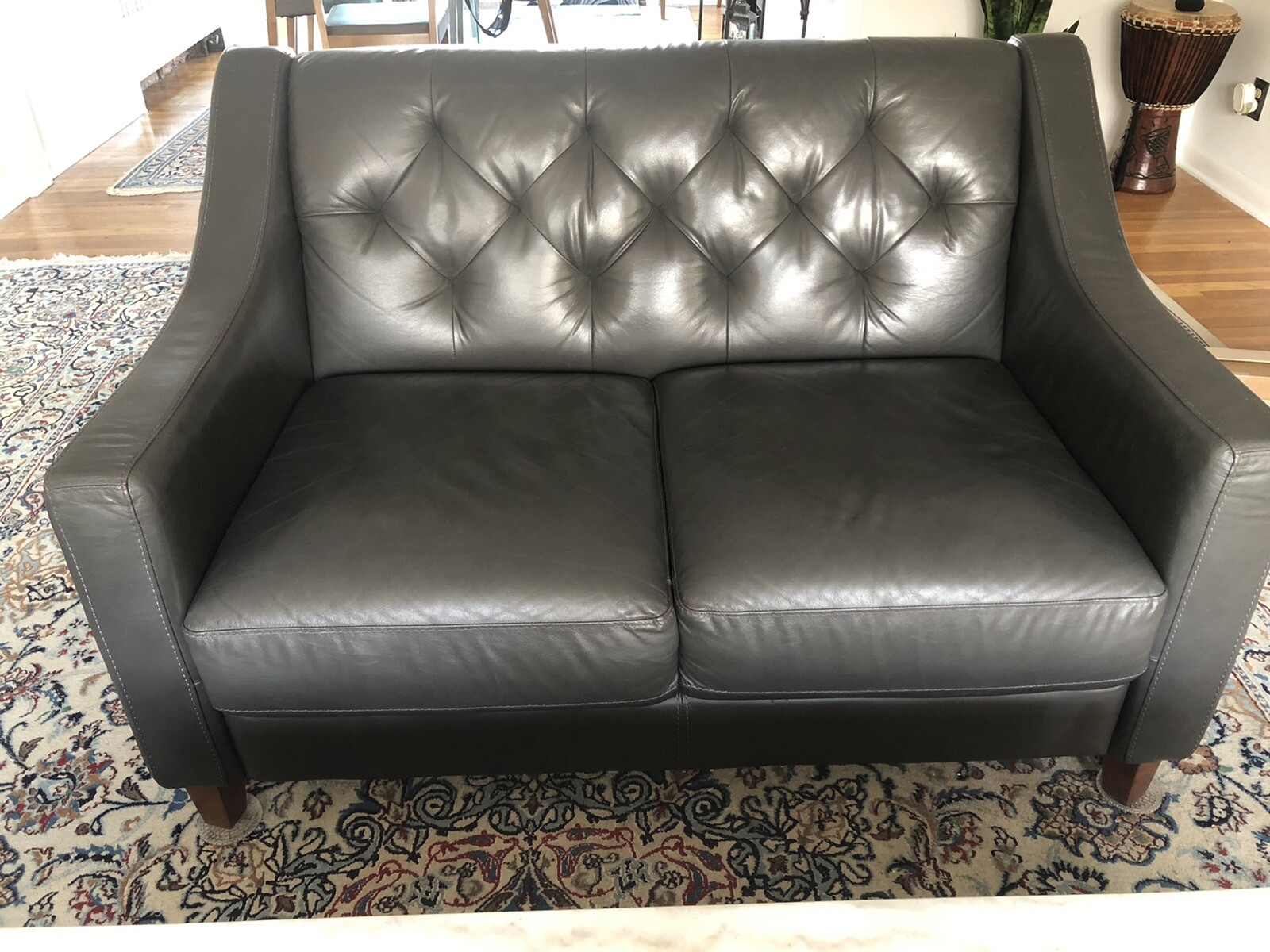 Gray leather loveseat