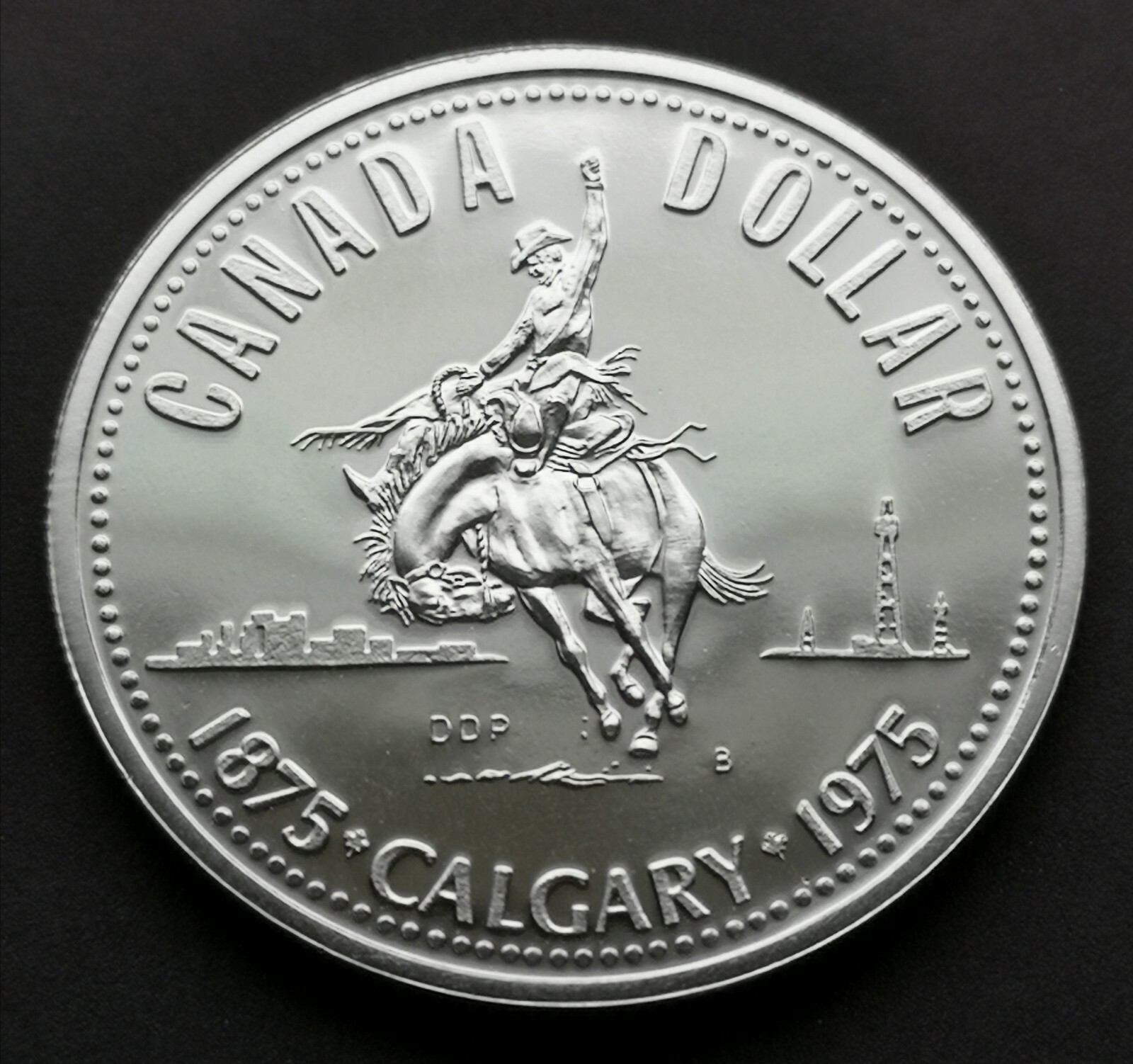 *** CANADA  BRILLANT  SILVER  DOLLAR  1975  ***  1875 - 1975  CALGARY  ***