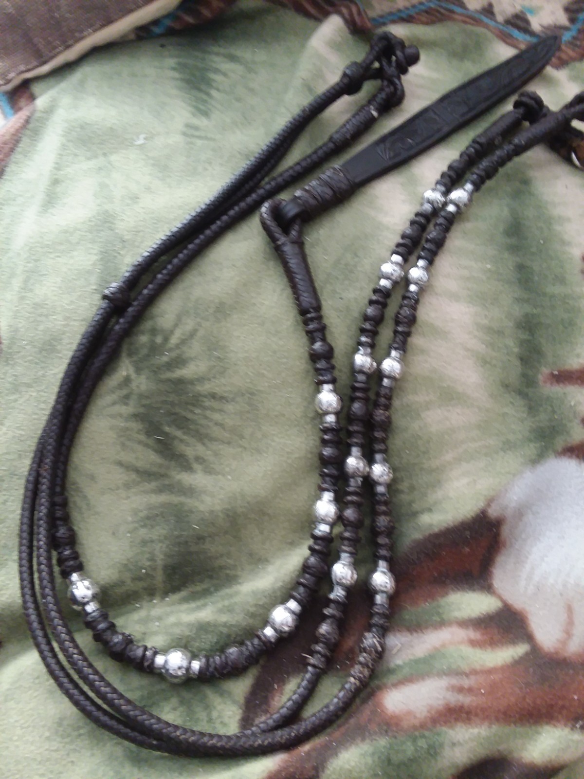 Vintage chocolate braided show romel reins with 15 silver ferrules, unmarked