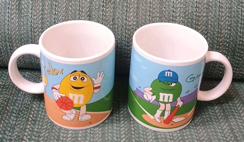 (2) 2002 M & M Character Ceramic Coffee Mugs by Galerie 2002 Green & Yellow M&M