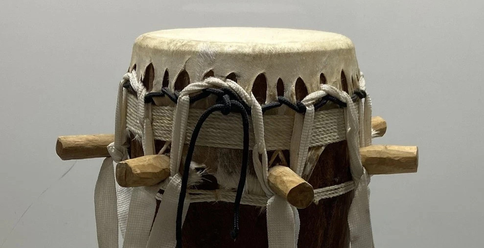 Wood and animal hide drum