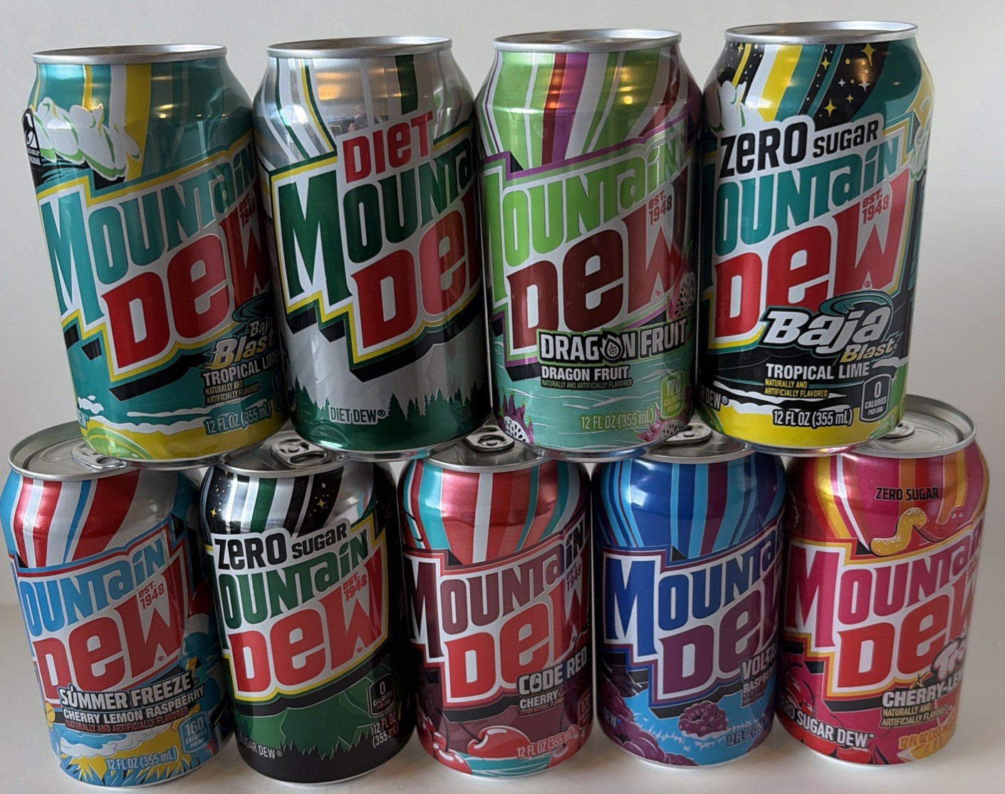 9 Different MTN DEW Cans  est. 1948 EMPTY BOTTOM OPENED