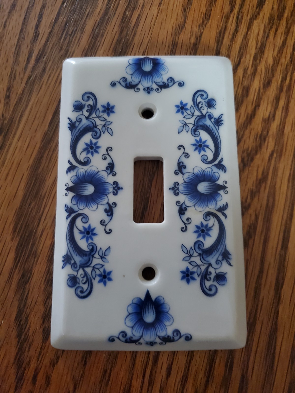 vintage porcelain light switch plate manufactured by J.M. Limoges in France