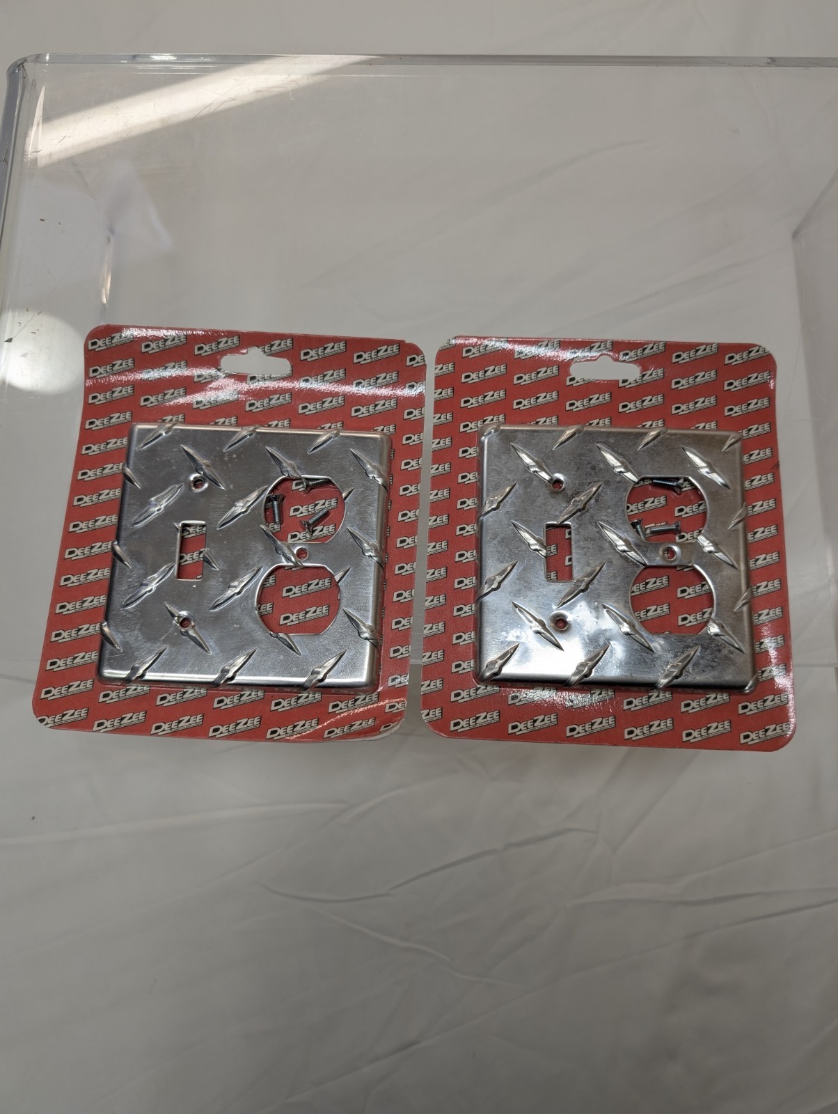 2 PCs DeeZee Brite Tread Outlet Cover. New Unopened Damaged Package